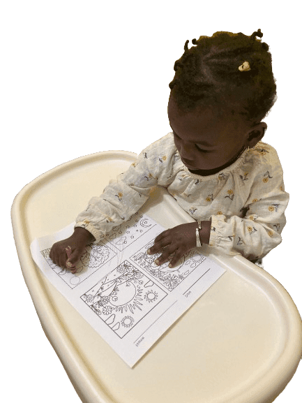 Toddler smiling while learning